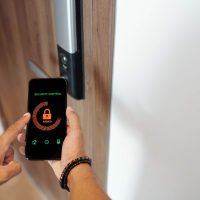 man-using-smart-lock-applicaition-E58EFPR.jpg